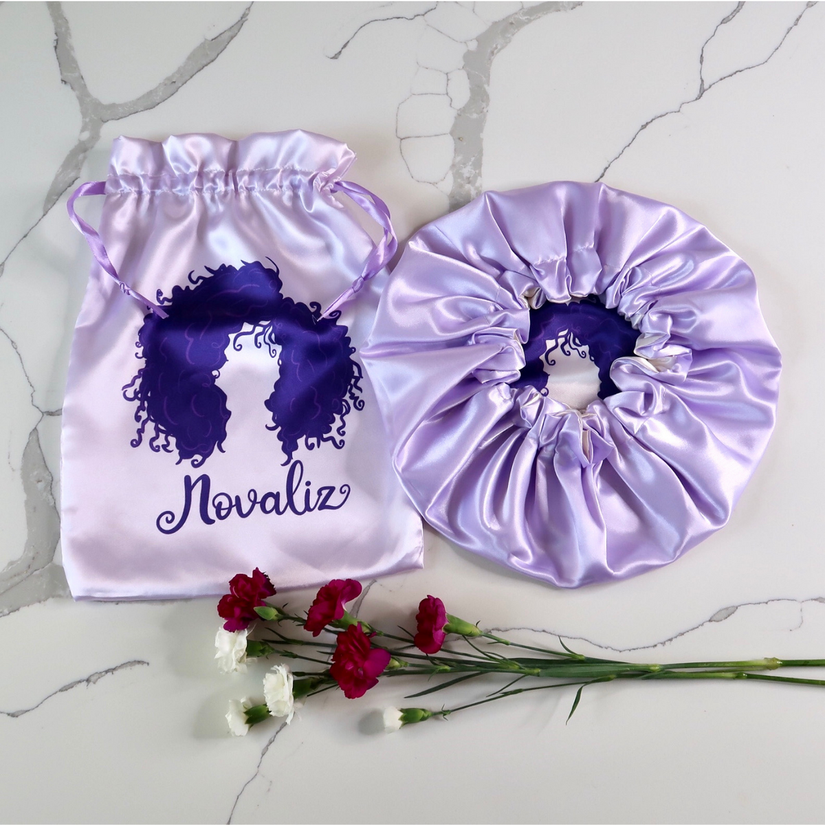 lilac silky satin bonnet with matching satin bag with dark pink logo of curly girl